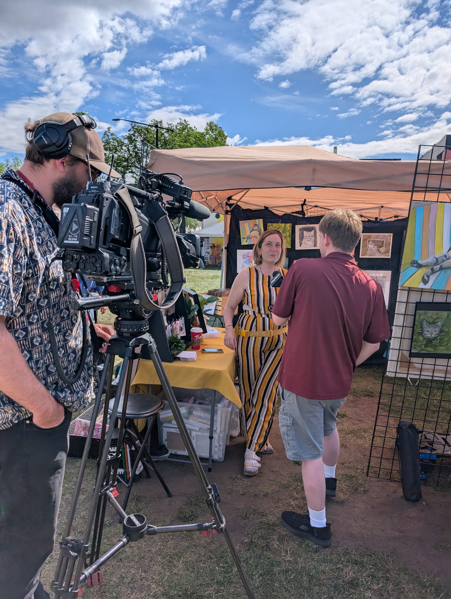 Colette Bachand at arts market with cat art